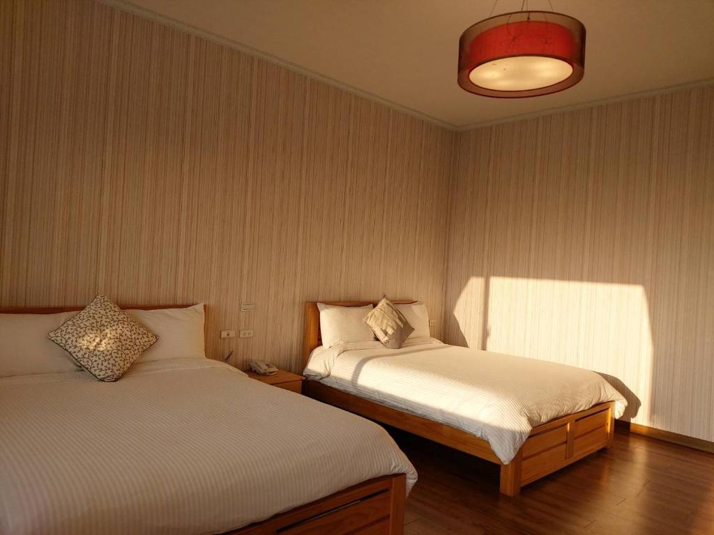 Postel nebo postele na pokoji v ubytování Chi House