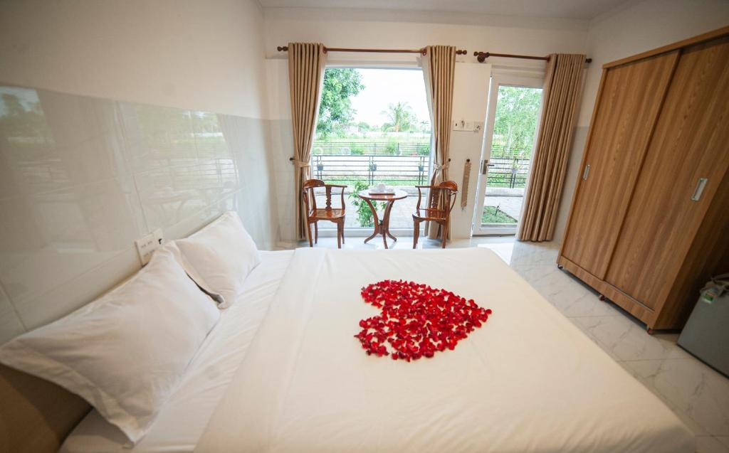 Postel nebo postele na pokoji v ubytování FaMi Nguyễn Homestay Châu Đốc