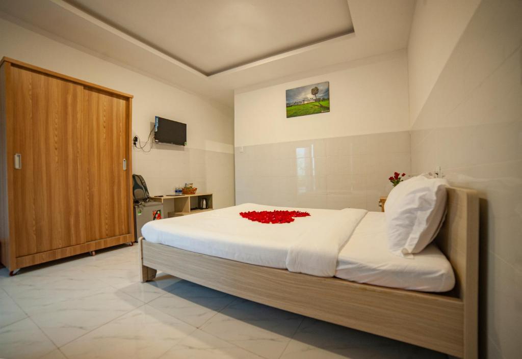 Postel nebo postele na pokoji v ubytování FaMi Nguyễn Homestay Châu Đốc