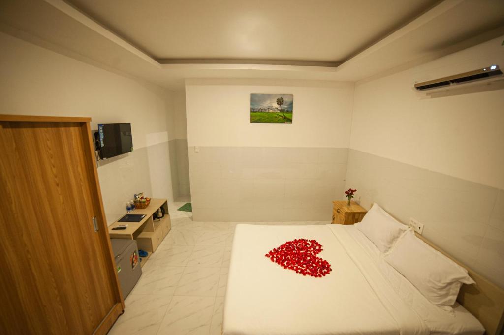 Postel nebo postele na pokoji v ubytování FaMi Nguyễn Homestay Châu Đốc