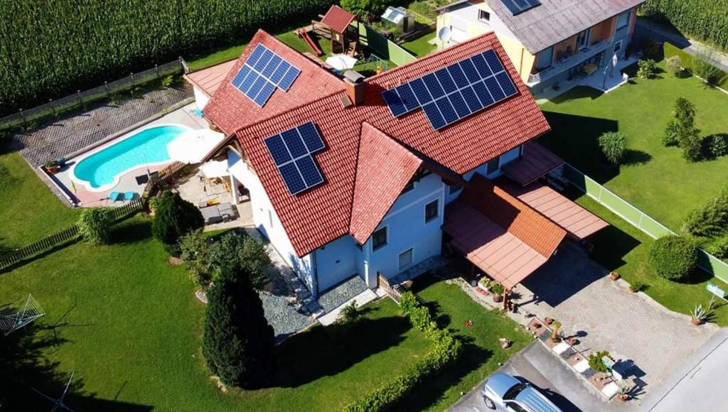 an aerial view of a house with solar panels on its roof at Gästehaus Nora in Stein