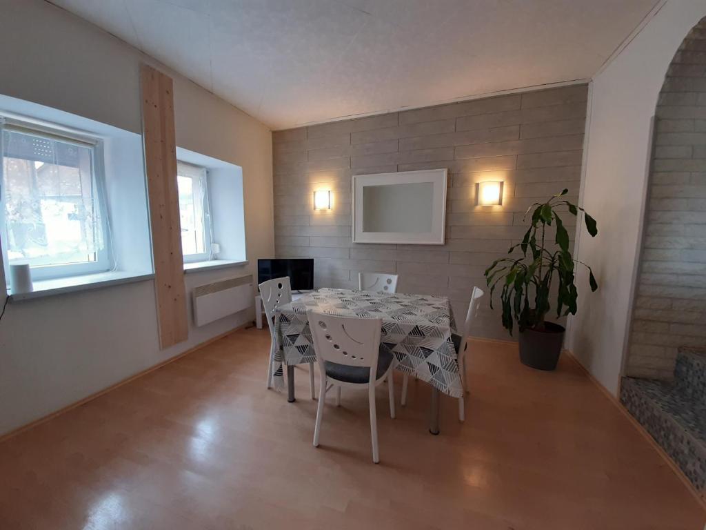 a dining room with a table and chairs at Townhouse for fitters / Haus für Monteure in Schraplau in Schraplau