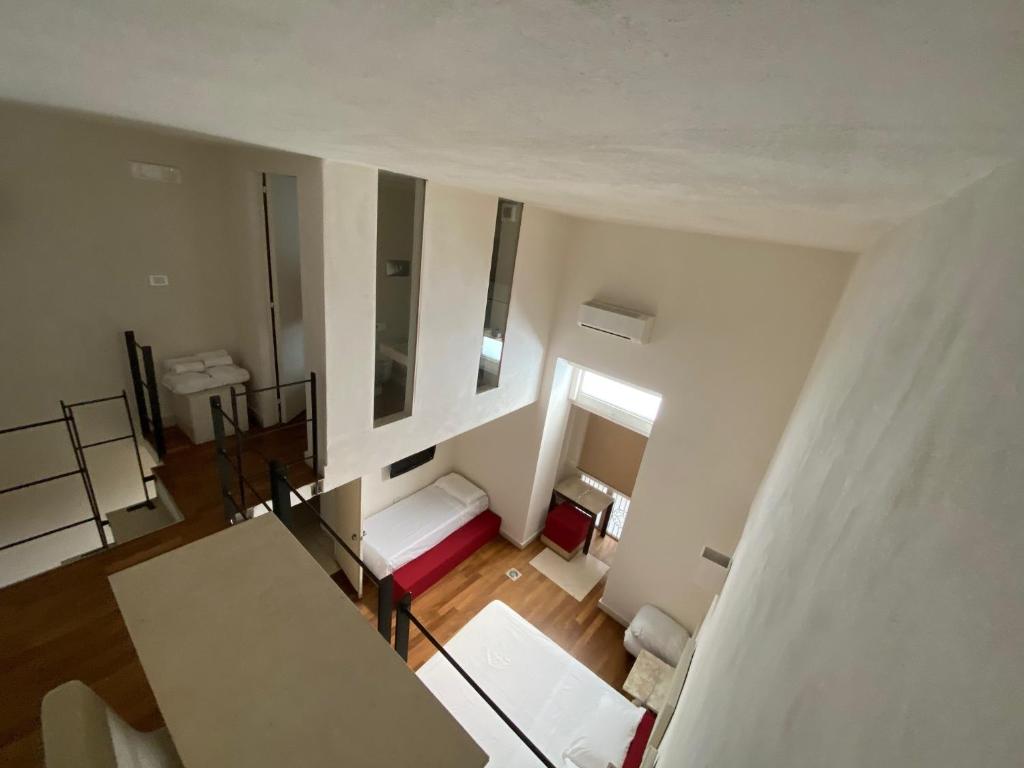 Łóżko lub łóżka w pokoju w obiekcie Micalò Art Rooms