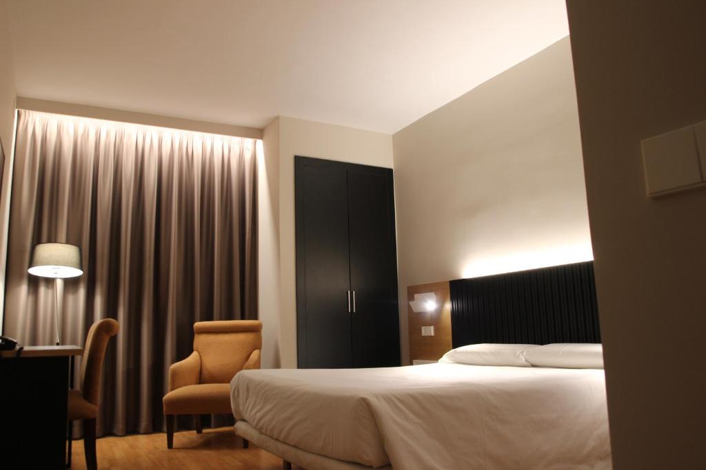 Postel nebo postele na pokoji v ubytování Hotel Alcántara