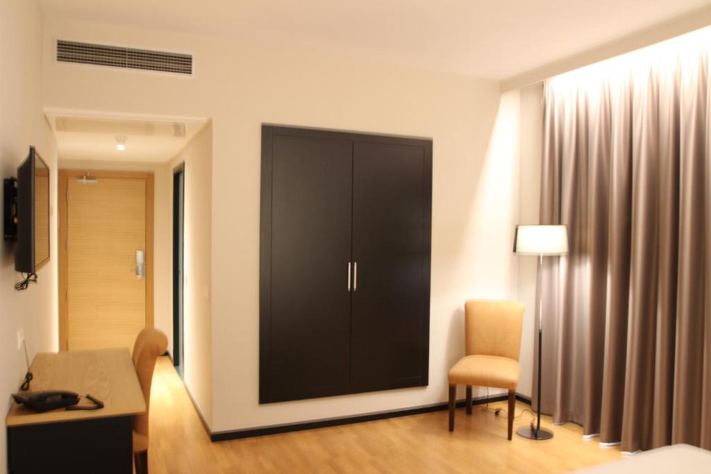 TV a/nebo společenská místnost v ubytování Hotel Alcántara