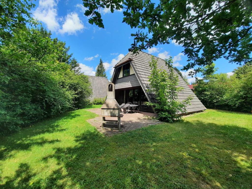 a house with a bench in front of it at Ferienhaus Winnetou 114 in Waldbrunn