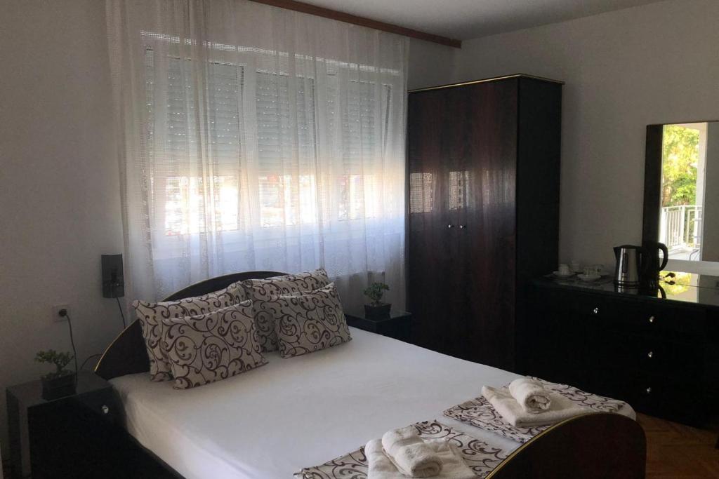 Postel nebo postele na pokoji v ubytování Apartments Ivan