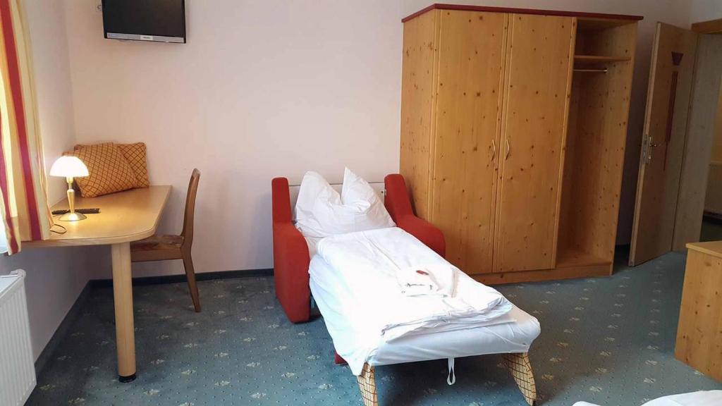 Postel nebo postele na pokoji v ubytování Gasthof Birgl