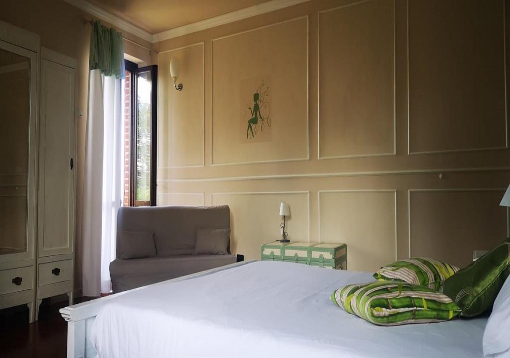 Postel nebo postele na pokoji v ubytování B&B esclusivo, nel cuore del Monferrato