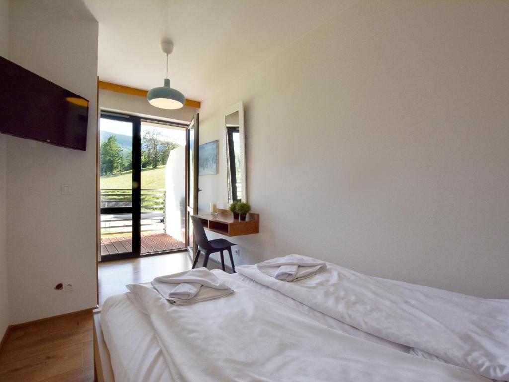 Posteľ alebo postele v izbe v ubytovaní VacationClub - Karkonoska 13 Apartament 61