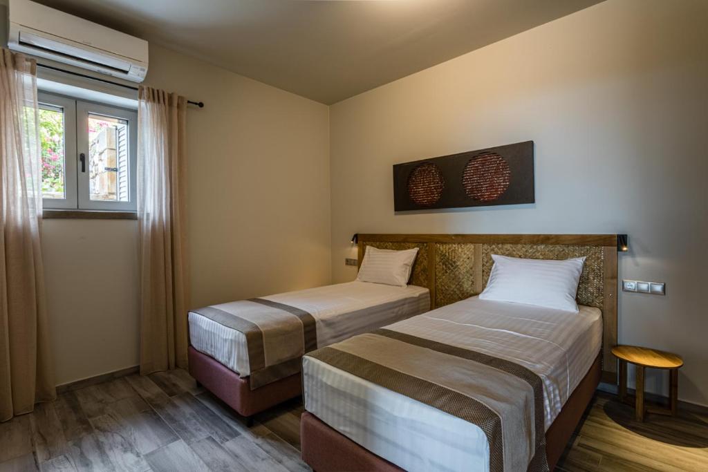 Кровать или кровати в номере Villa Achilleas
