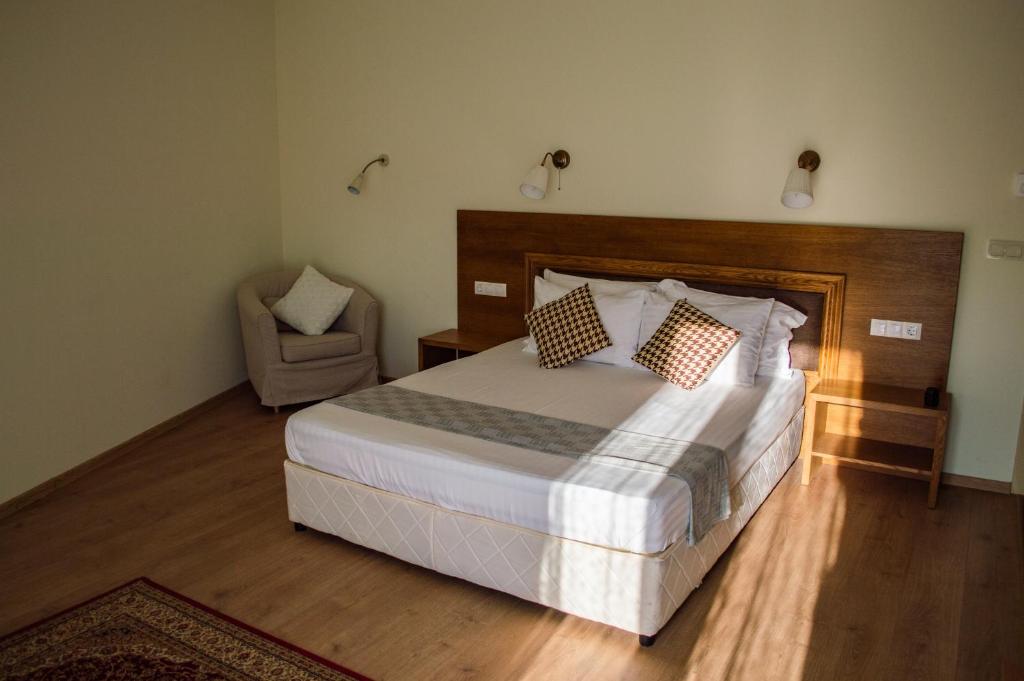 Postel nebo postele na pokoji v ubytování Aleksion Palace