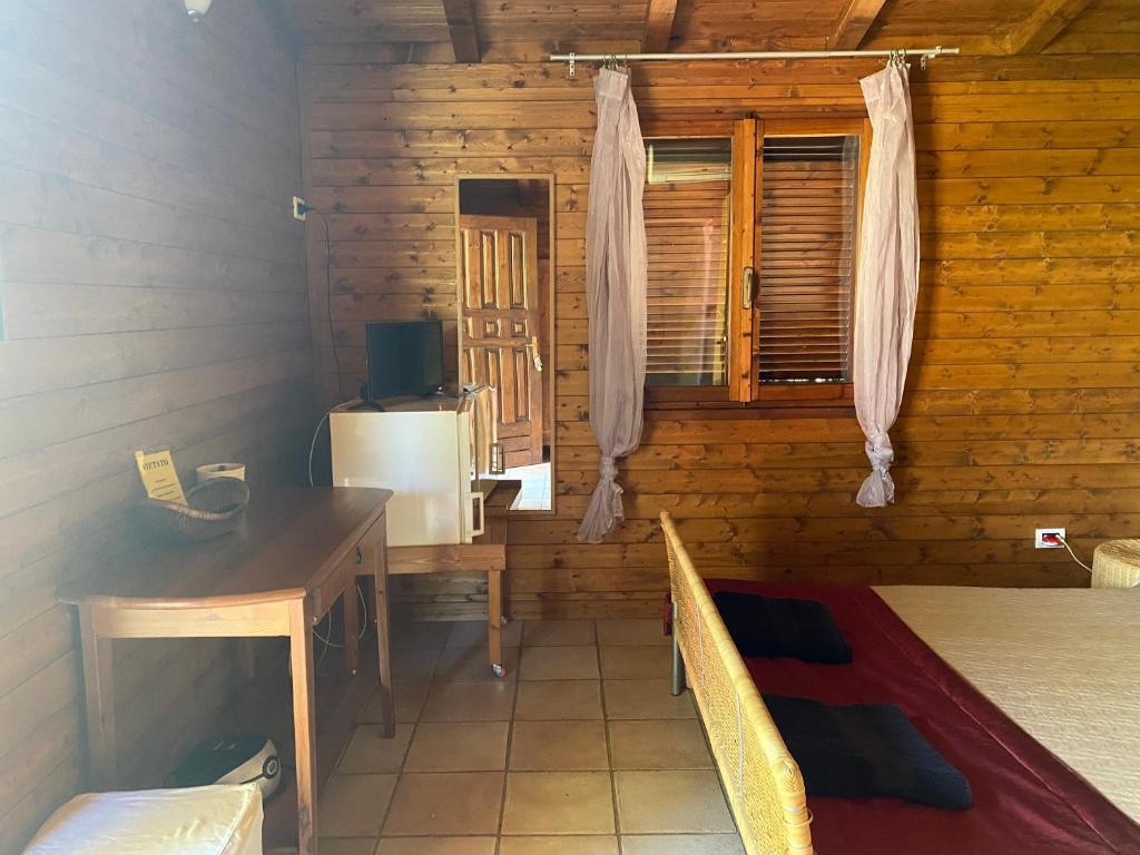 Postel nebo postele na pokoji v ubytování I Giardini Di Margius