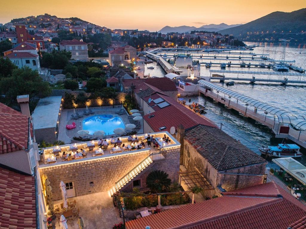a view of a marina with a swimming pool at Orka Apartments in Dubrovnik