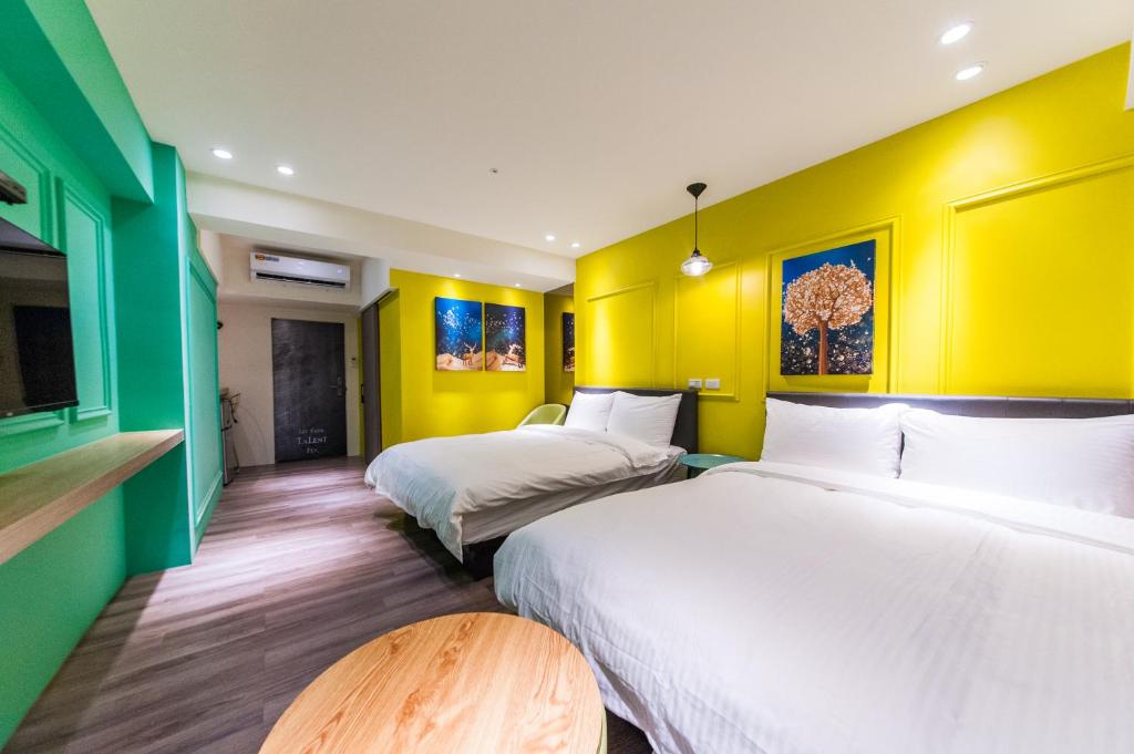 Postel nebo postele na pokoji v ubytování Talent Hotel