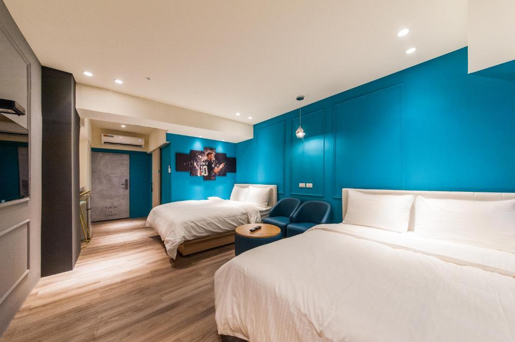 Postel nebo postele na pokoji v ubytování Talent Hotel
