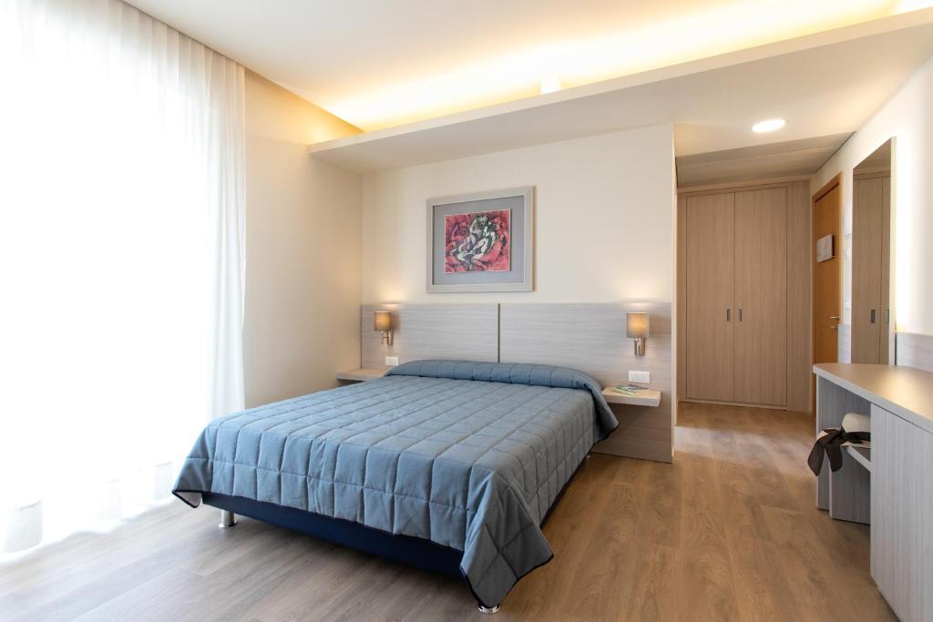 Postel nebo postele na pokoji v ubytování Hotel Ancora