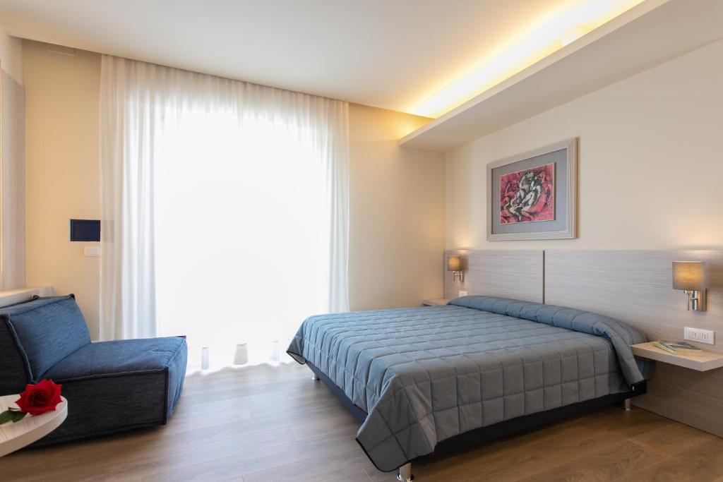 Postel nebo postele na pokoji v ubytování Hotel Ancora