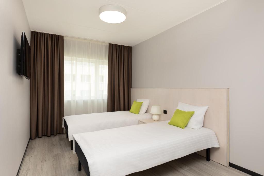 Postel nebo postele na pokoji v ubytování U11 Hotel & SPA