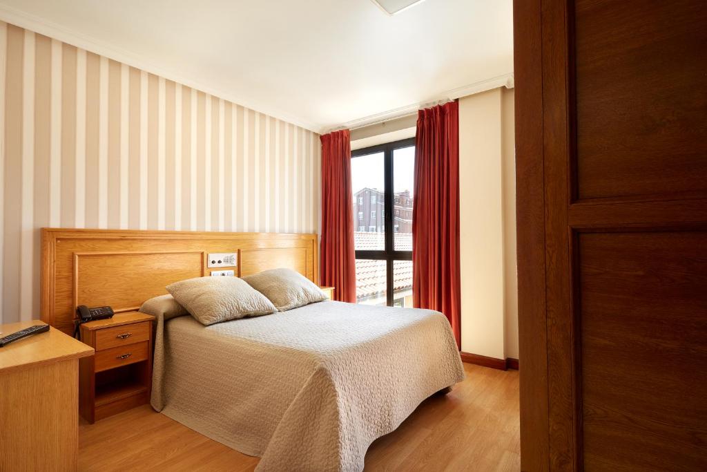 Postel nebo postele na pokoji v ubytování Hotel Piedras