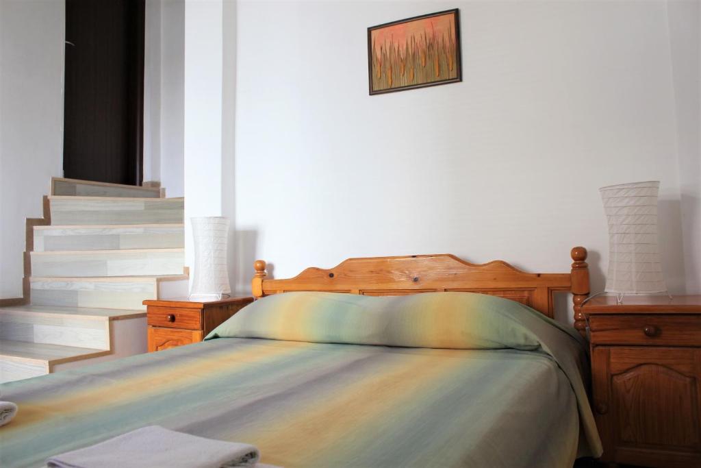 Łóżko lub łóżka w pokoju w obiekcie Radik Guest Rooms