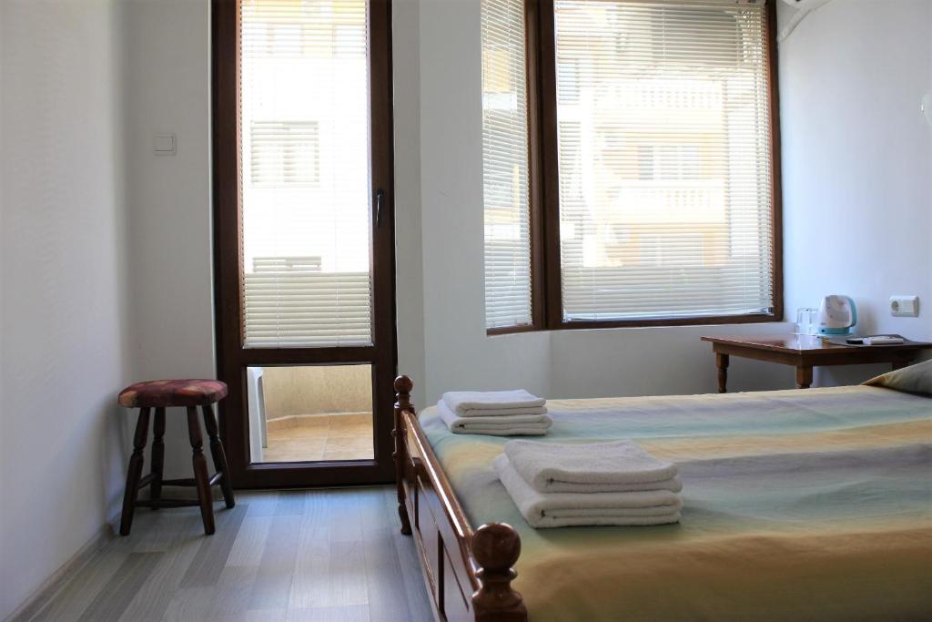 Postel nebo postele na pokoji v ubytování Radik Guest Rooms