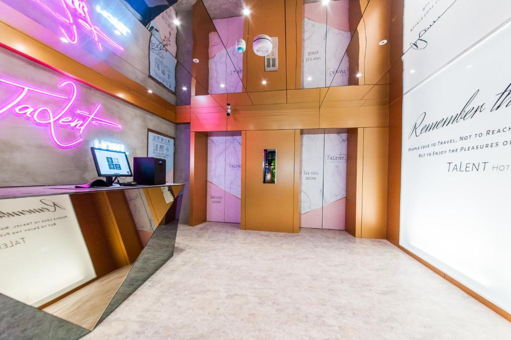 TV a/nebo společenská místnost v ubytování Talent Hotel