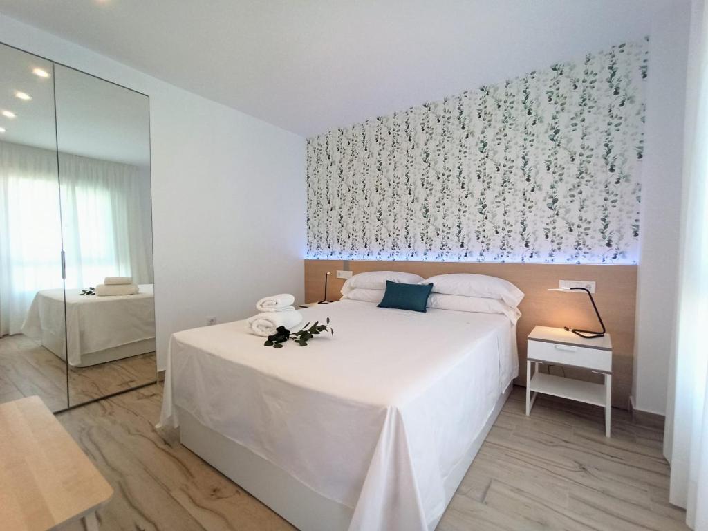 Ένα ή περισσότερα κρεβάτια σε δωμάτιο στο Bahia Deluxe