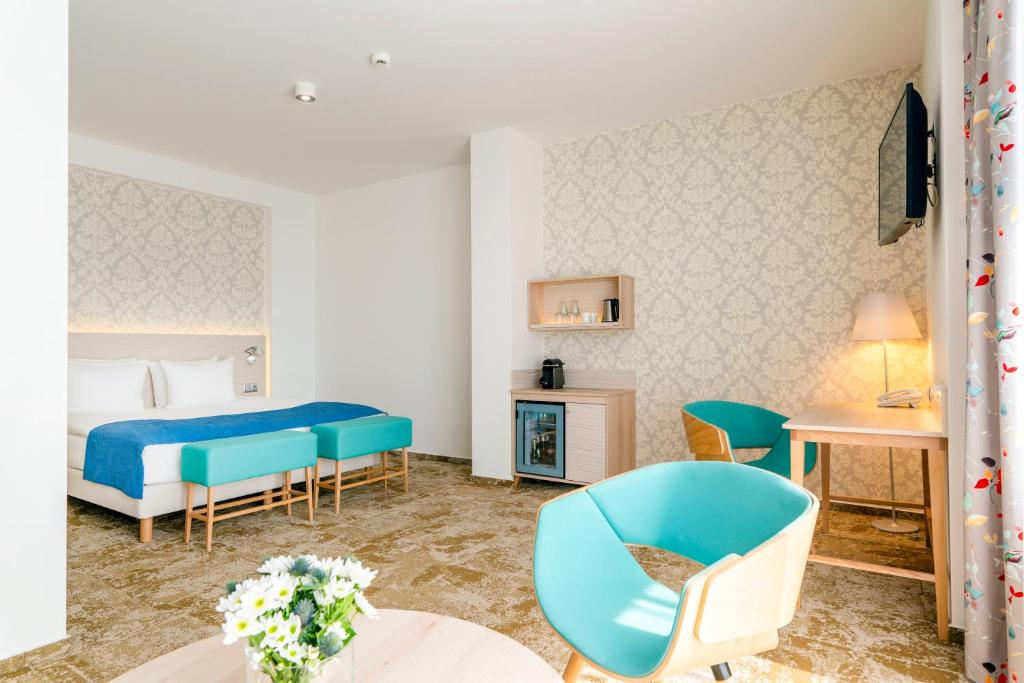 Postel nebo postele na pokoji v ubytování Hotel Metropol