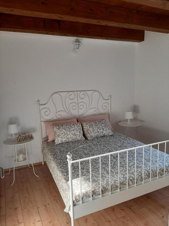 Postel nebo postele na pokoji v ubytování Casa Nonna Tereza