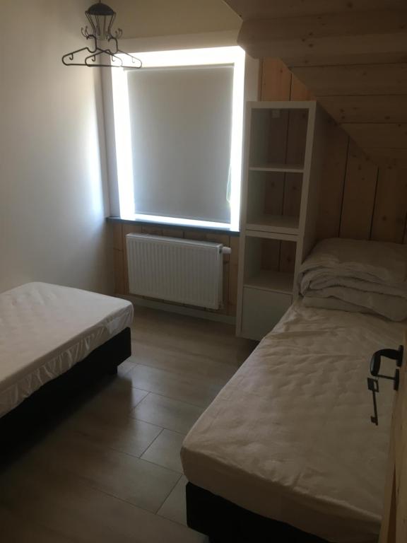 Postel nebo postele na pokoji v ubytování ROUTE 63