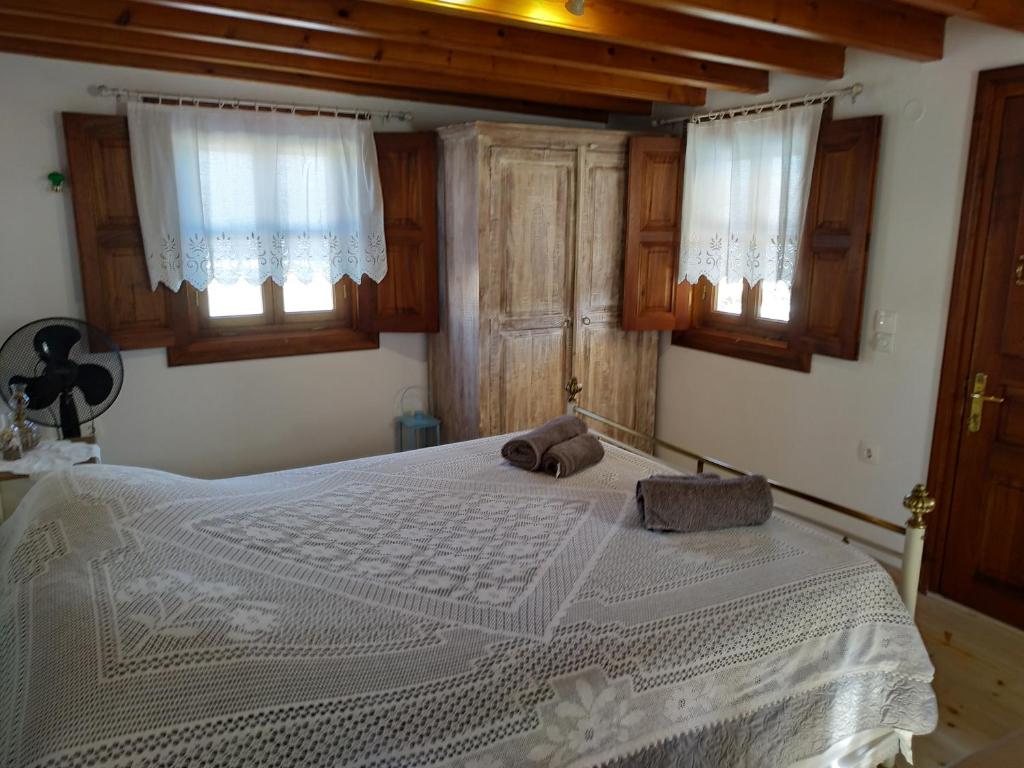 Postel nebo postele na pokoji v ubytování Manos House in Chora