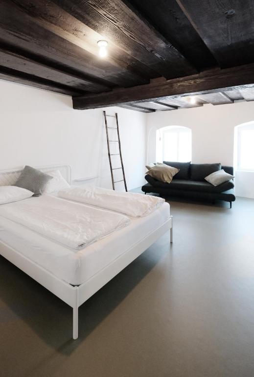 Postel nebo postele na pokoji v ubytování CHARMANTES APARTMENT im Herzen von Linz