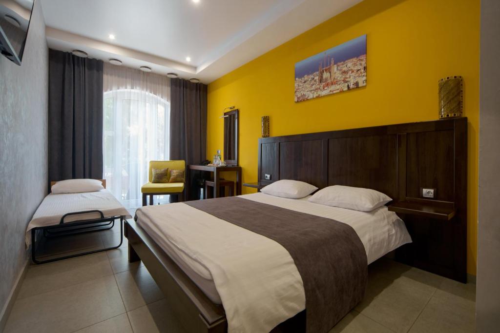 Postel nebo postele na pokoji v ubytování Gaudi stylish hotel