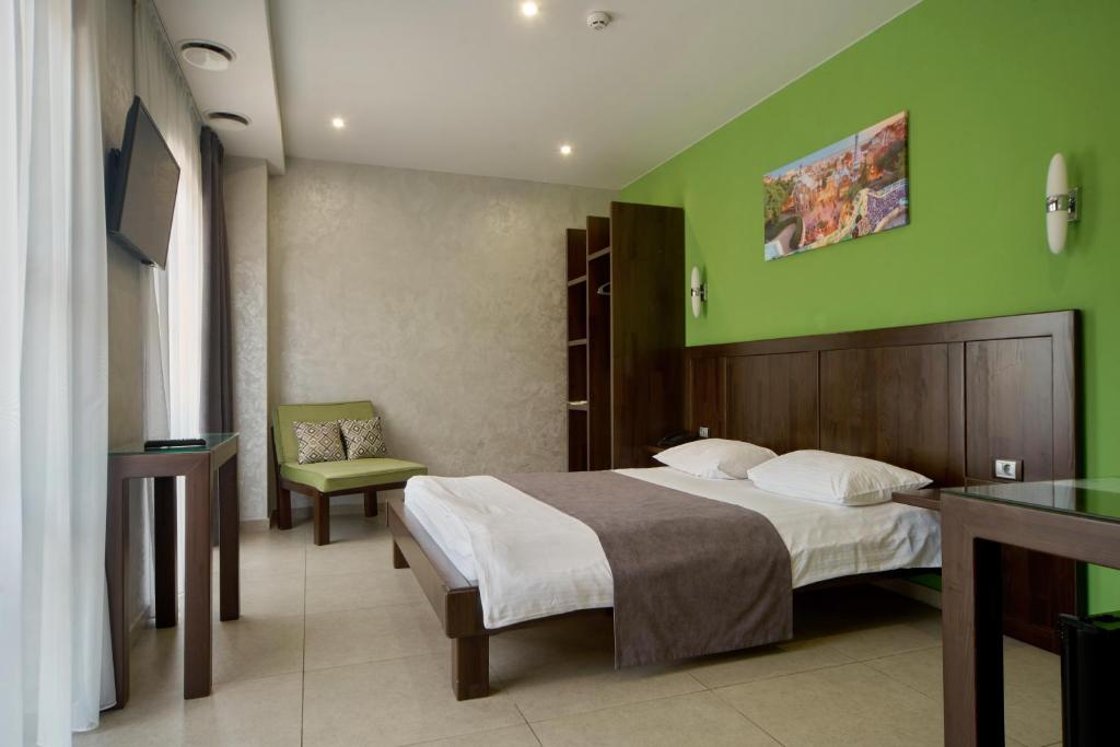 Postel nebo postele na pokoji v ubytování Gaudi stylish hotel