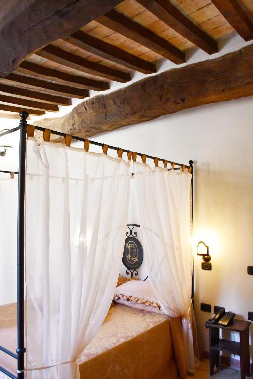 Postel nebo postele na pokoji v ubytování Grand Relais Laurenti