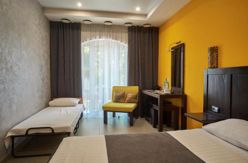 Postel nebo postele na pokoji v ubytování Gaudi stylish hotel