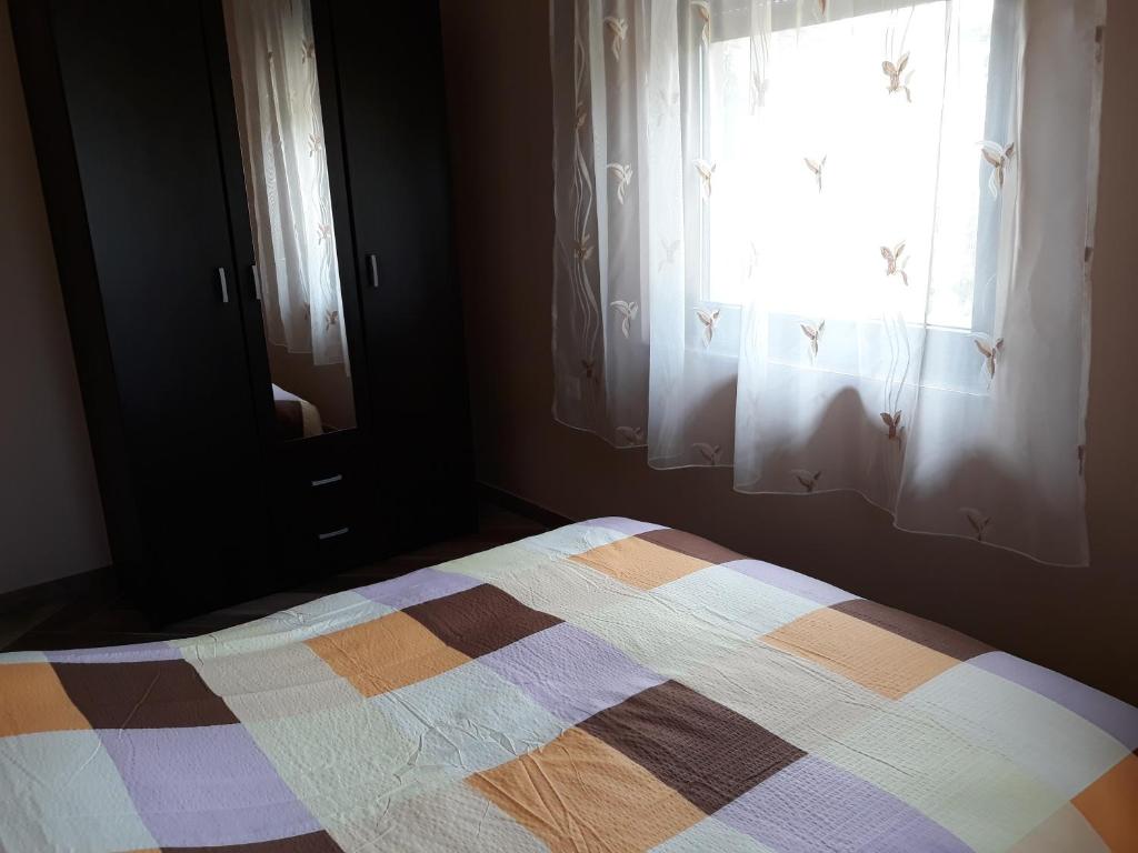 Postel nebo postele na pokoji v ubytování Andi Apartman
