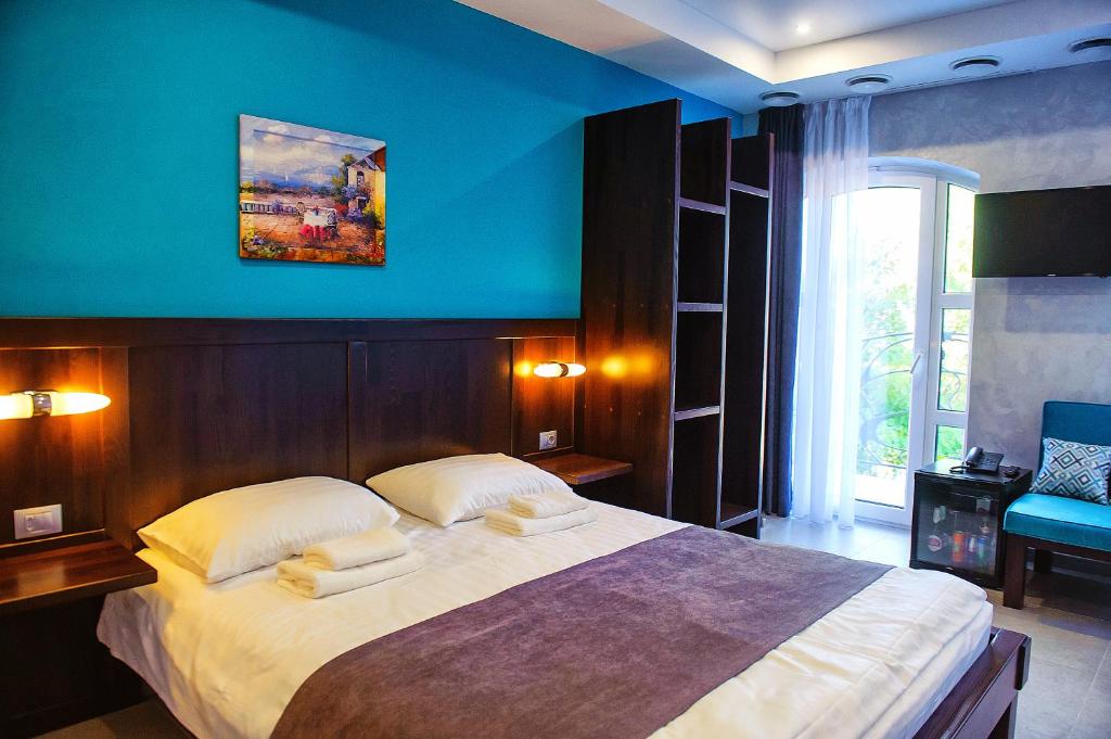 Postel nebo postele na pokoji v ubytování Gaudi stylish hotel
