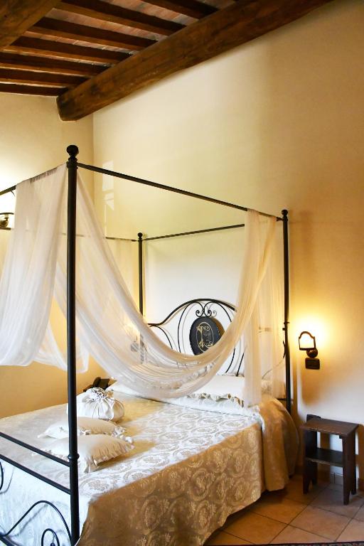 Postel nebo postele na pokoji v ubytování Grand Relais Laurenti