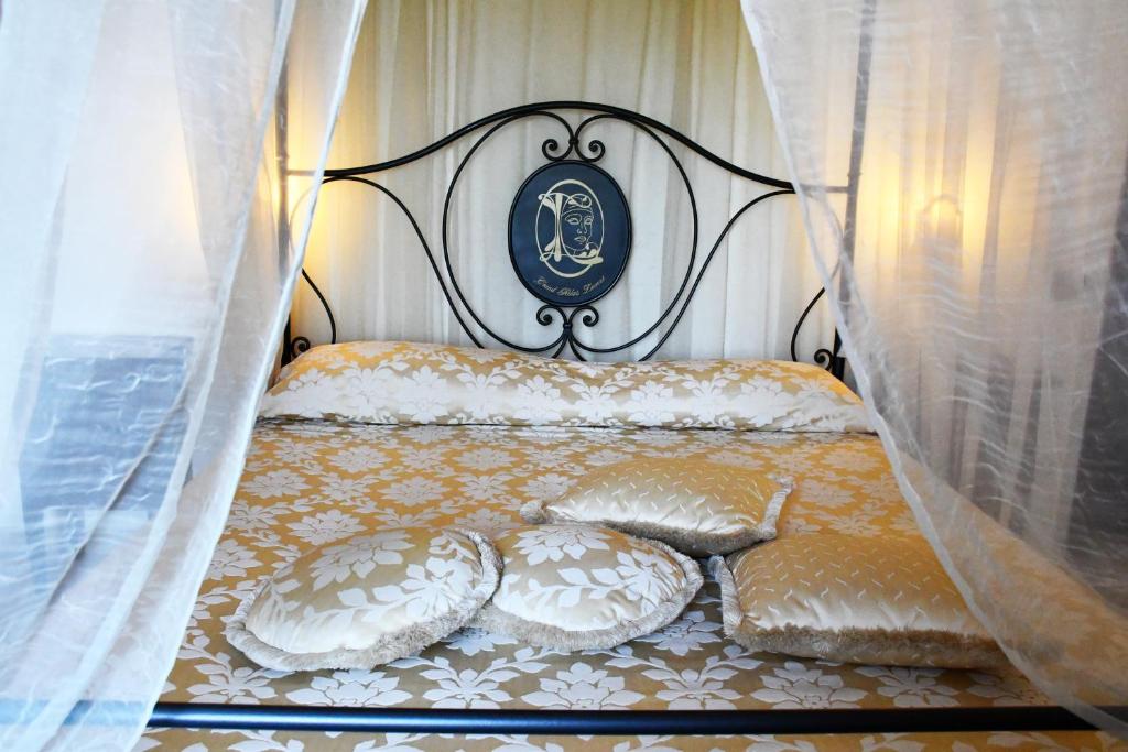 Postel nebo postele na pokoji v ubytování Grand Relais Laurenti