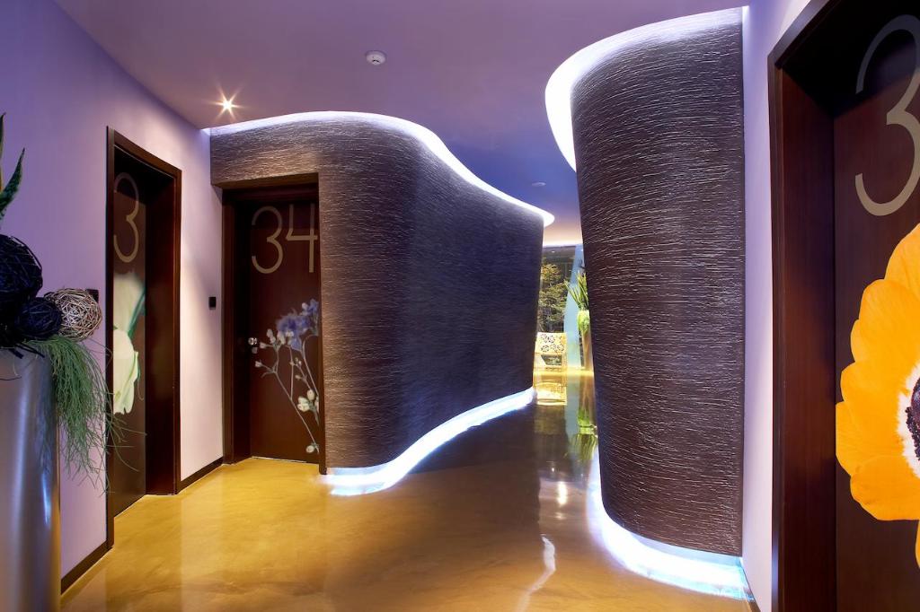 a room with a hallway with a large letter m at Les Fleurs Boutique Hotel in Sofia