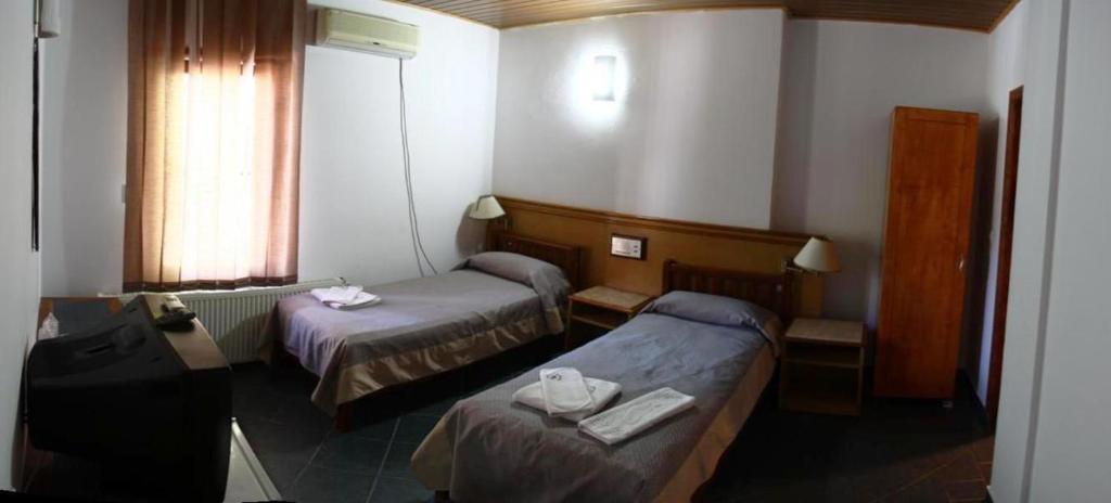 Postel nebo postele na pokoji v ubytování Albatros