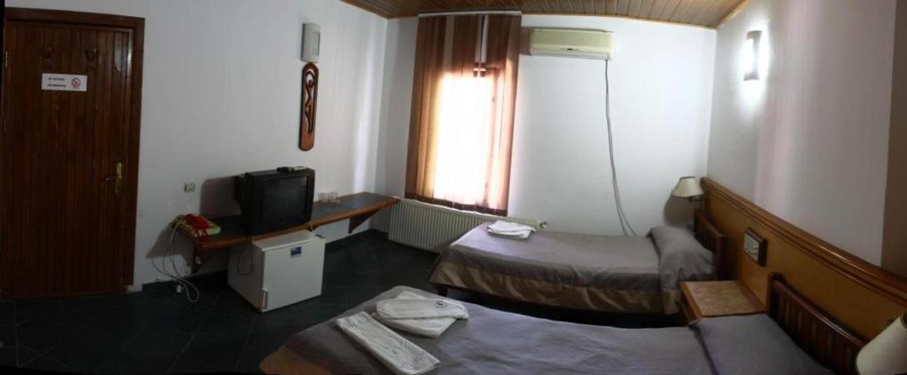 Postel nebo postele na pokoji v ubytování Albatros