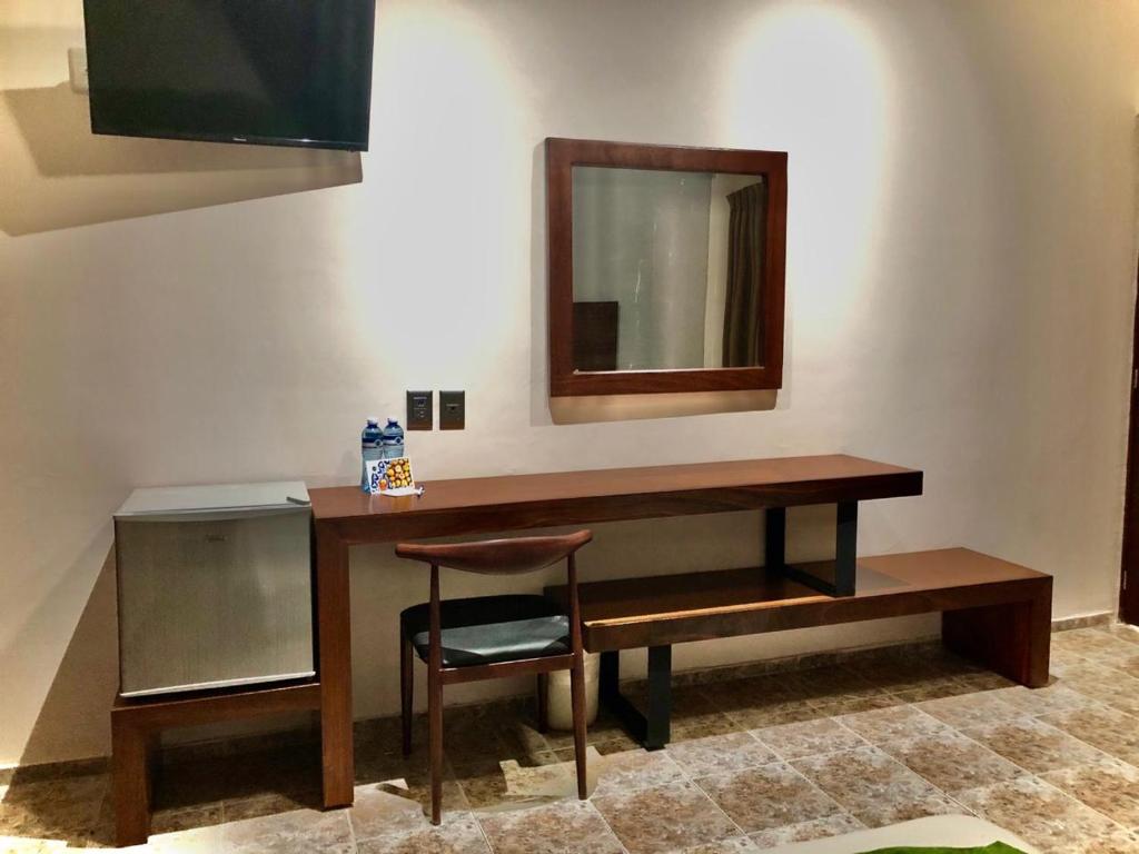 TV a/nebo společenská místnost v ubytování Hotel del Camino Real