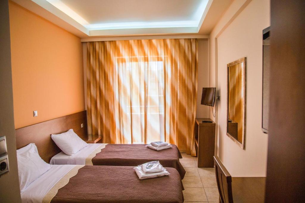Postel nebo postele na pokoji v ubytování Hotel Giorgio