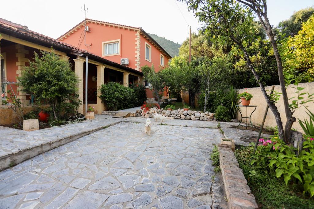 a courtyard with a fire hydrant in a yard at George's Sweet n' Cozy Maisonette in Ipsos Corfu in Ýpsos