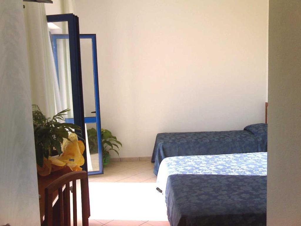 Posteľ alebo postele v izbe v ubytovaní Sea Garden Hotel