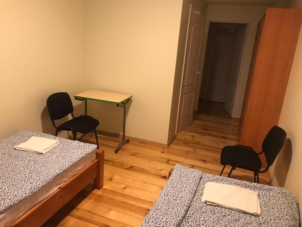 Postel nebo postele na pokoji v ubytování SIA Cikstonis
