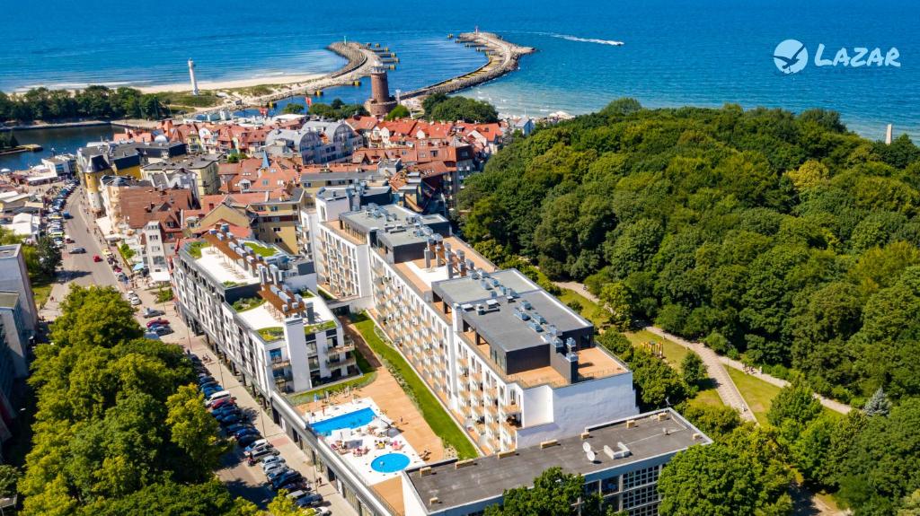 an aerial view of a town next to the water at Lazar Apartamenty Nadmorskie Tarasy in Kołobrzeg